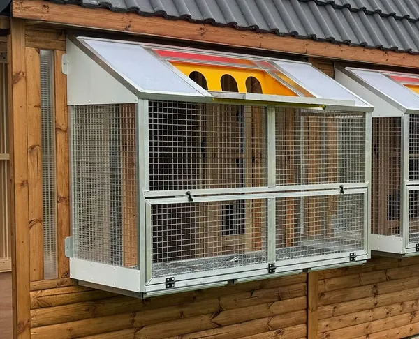 Aluminium trap mechanism on apex pigeon loft, close-up detail