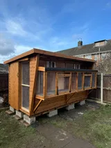 Combi Pent Pigeon Loft timber frame with mesh sections and solid enclosed bay