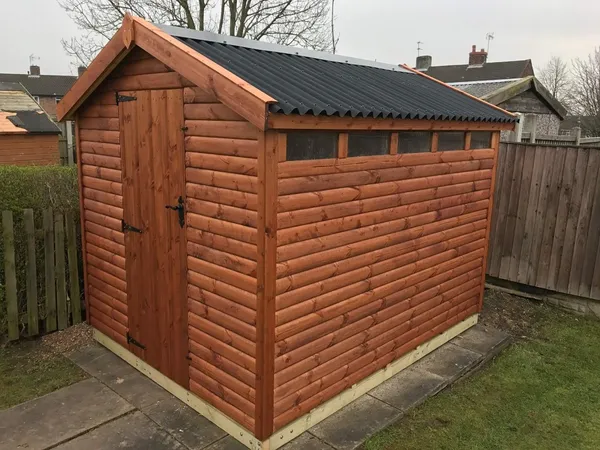 Warm stained apex garden shed with single door and high-level windows on patio