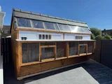 The Ultimate Apex Pigeon Loft with multi-compartment mesh fronts, arched entries and tiled roof