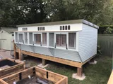 The Ultimate Pent Pigeon Loft with aviary trap, painted finish on raised platform