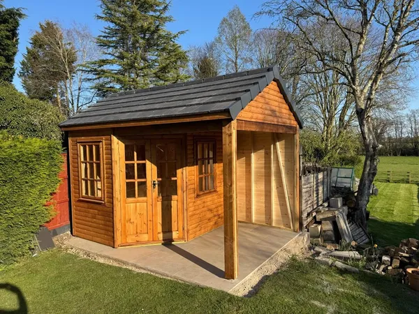 The Amber Veranda Summerhouse with tiled roof and open veranda on paved patio