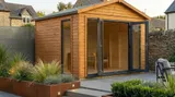 The Modern Apex Garden Room with UPVC french doors wide open, showing the spacious timber interior