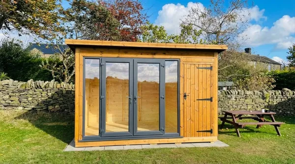 The Denby Combi with anthracite glazing and storage section on paved base