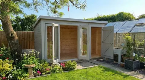 The Denby Combi Summerhouse with glazed doors open and storage section open, showing interior space