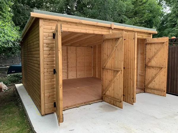 Interior during installation showing massive open span, structural framing and robust door bracing