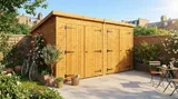 Wide-span pent double garage with dual double doors closed in a landscaped setting