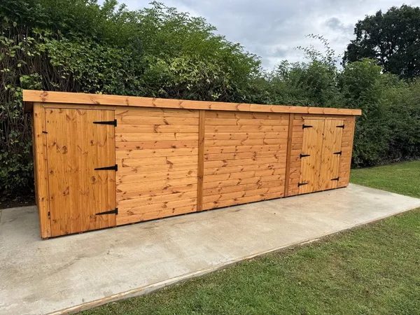 Ultra-wide timber utility block on concrete pad, showcasing scalable footprint