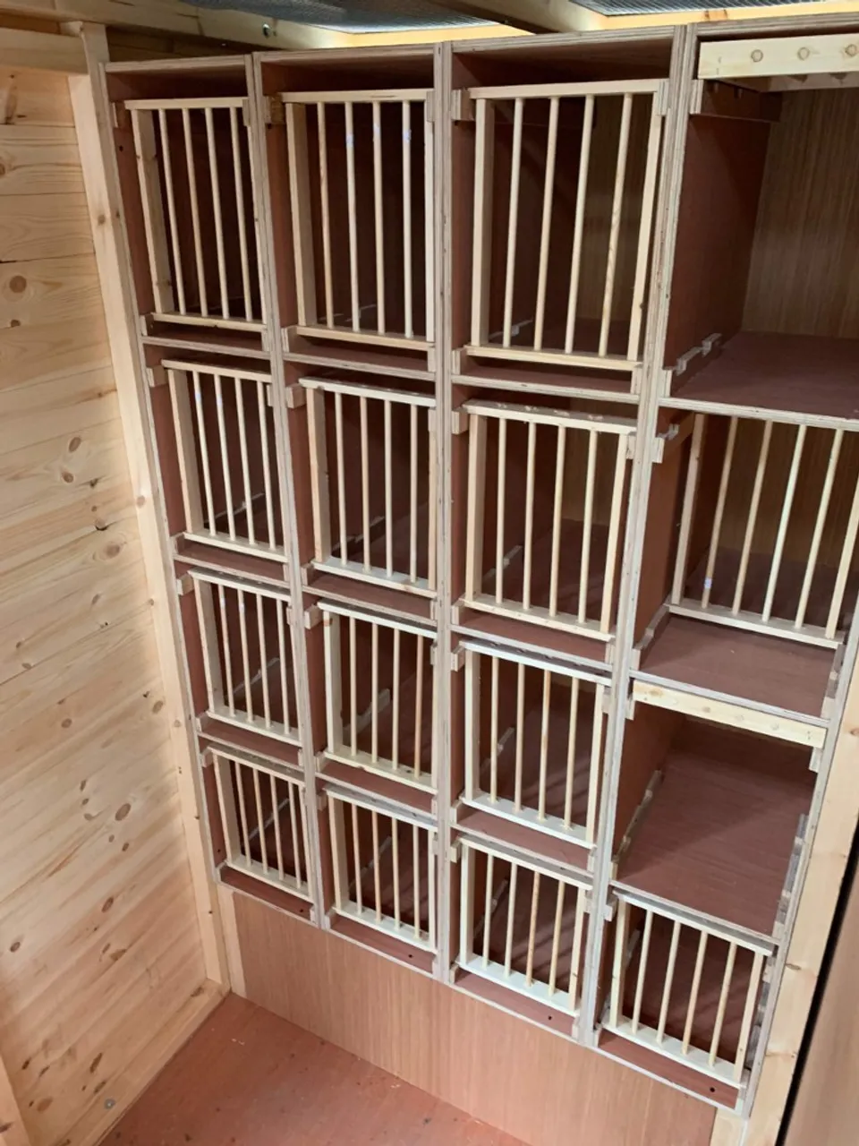 Up and over hen boxes fitted inside a timber pigeon loft