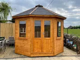 The Panoramic Octagon front view on lawn with clear glazing