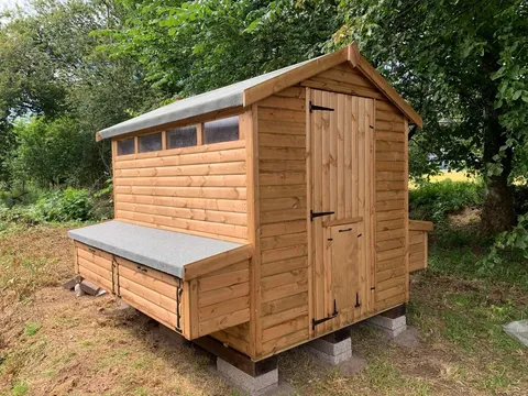 Walk-in poultry shed with massive external nest boxes and felt-covered hinged lids – Ecco Sheds animal housing