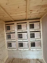 Standard up and over nest boxes installed in a timber loft