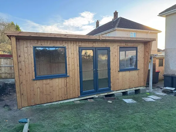 Modern pent workshop featuring contemporary anthracite UPVC doors and windows