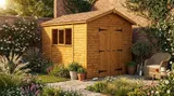 Apex timber workshop in a landscaped garden, double doors closed