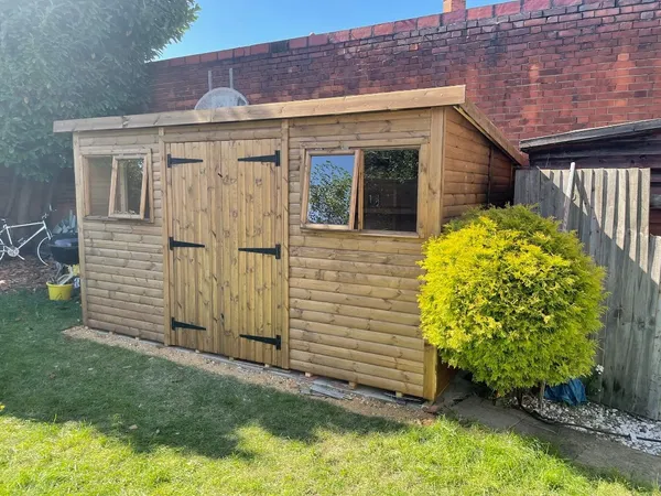 Exterior view of a large pent workshop showing its modern, low-profile design